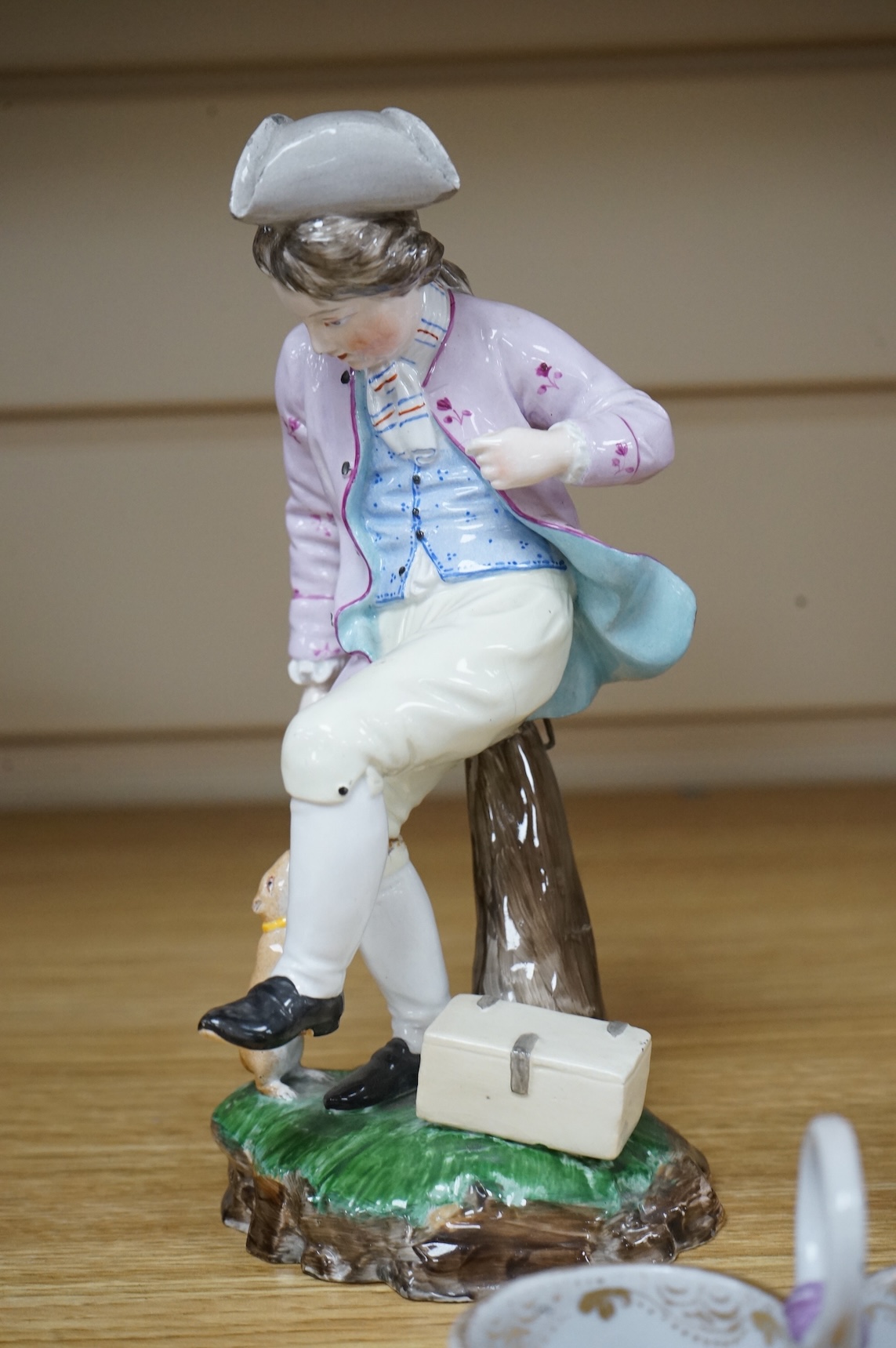 A pair of 19th century Hochst Damm faience figures and a Meissen twin section salt, tallest figure 20cm